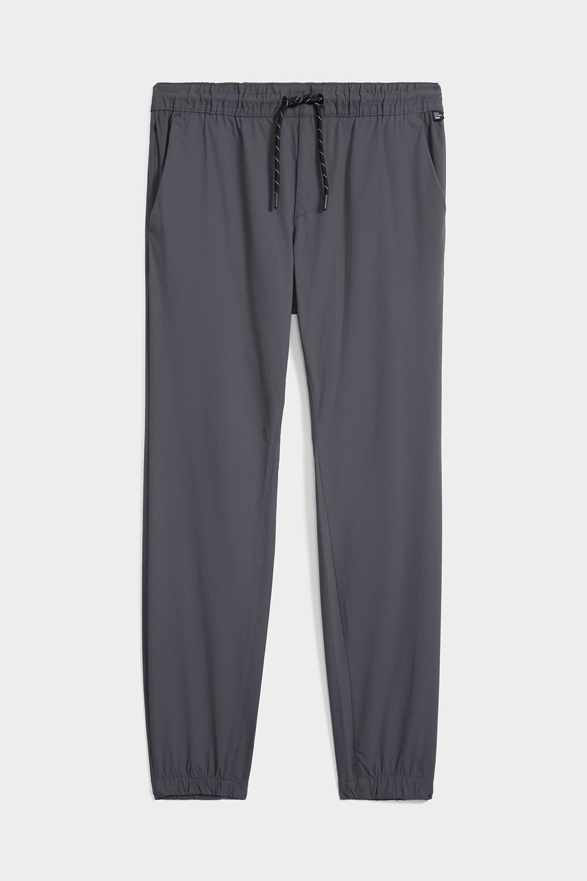 The TECH APPAREL MENS DRI-FLEX JOGGER in gray features an athletic fit, elastic waistband with black drawstring, side pockets, and elastic ankle cuffs, displayed flat on a light gray background.